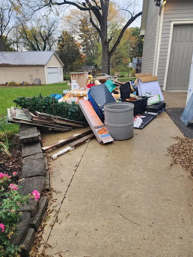 Dumpster being loaded with debris for 30 Yard Dumpster Rental in Martins Ferry